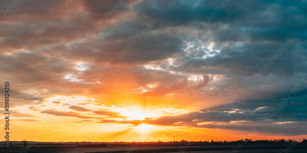 Sun Shine During Sunset Above Empty Spring Countryside Rural Soil Landscape. Field Under Sunny Spring Sky. Agricultural Landscape With Copy Space. Panorama