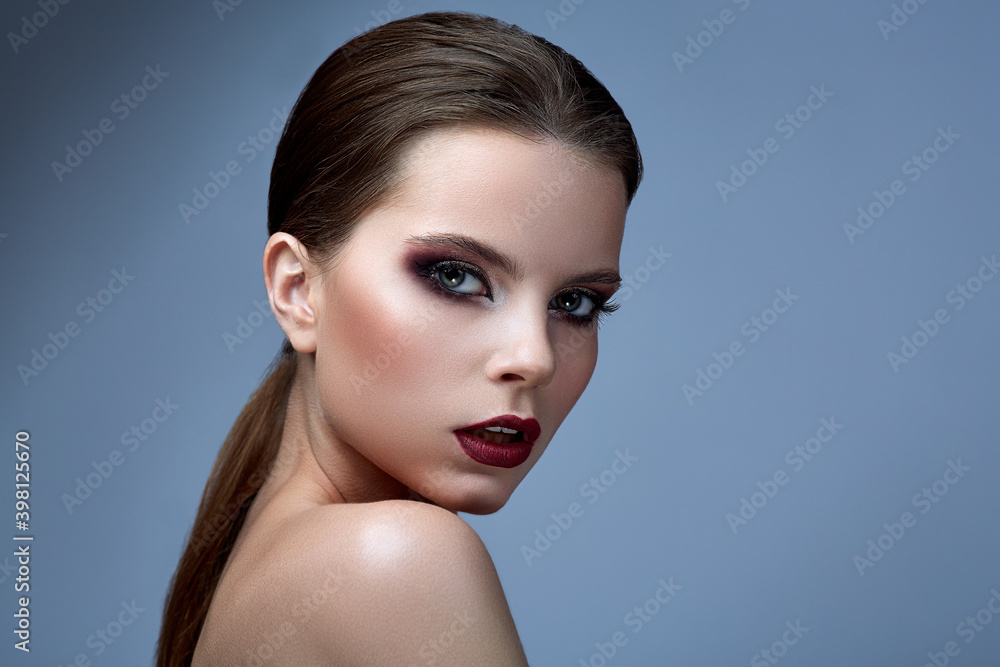 Face of a beautiful girl with smoky eyes makeup. Face of a beautiful girl with smoky eyes makeup.