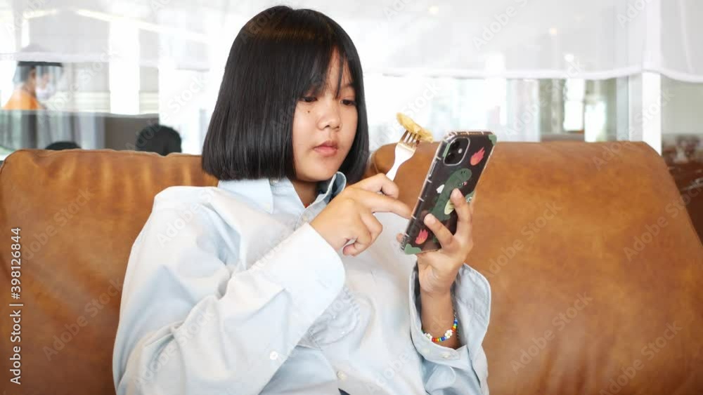 An Asian teenature rest relaxing in the living room An Asian teenature rest relaxing in the living room
