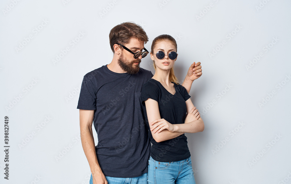 young couple black t-shirts sunglasses studio emotions romance Studio young couple black t-shirts sunglasses studio emotions romance Studio