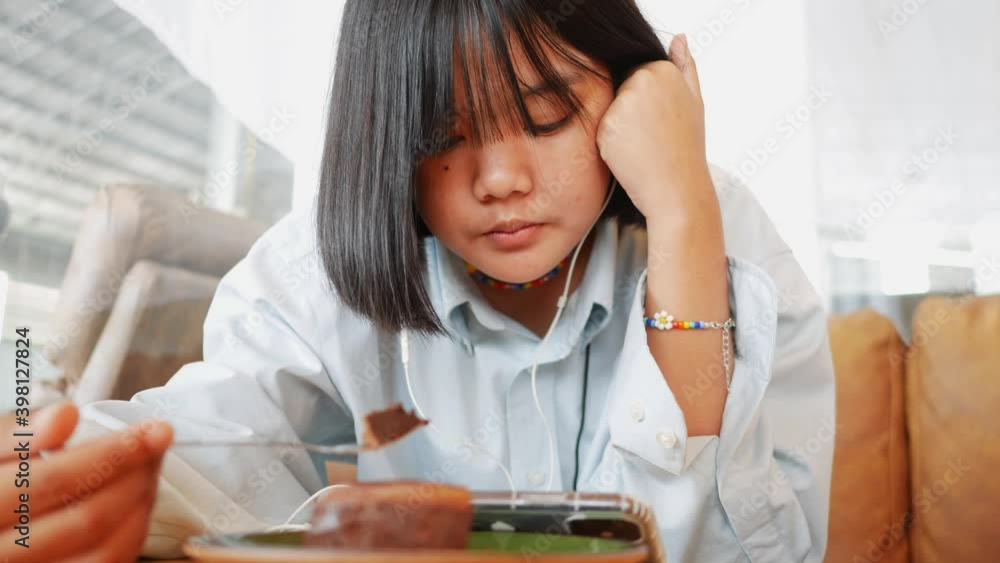 An Asian teenature rest relaxing in the living room