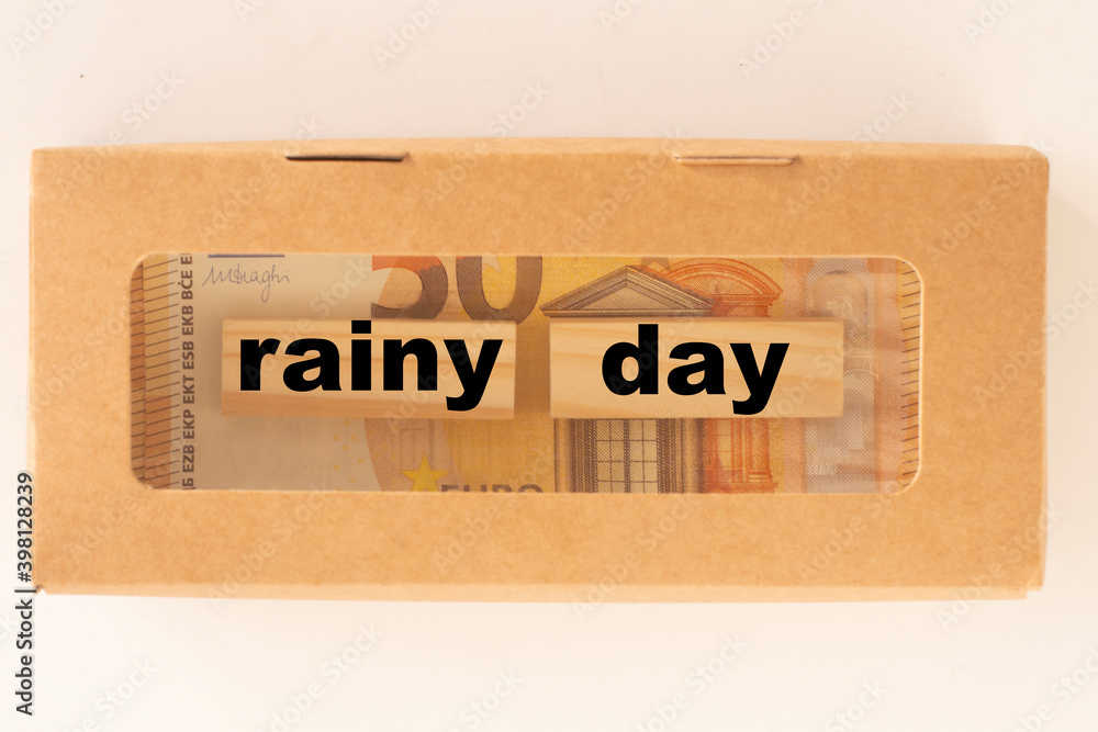 Rainy day is written on wooden blocks in a craft box.