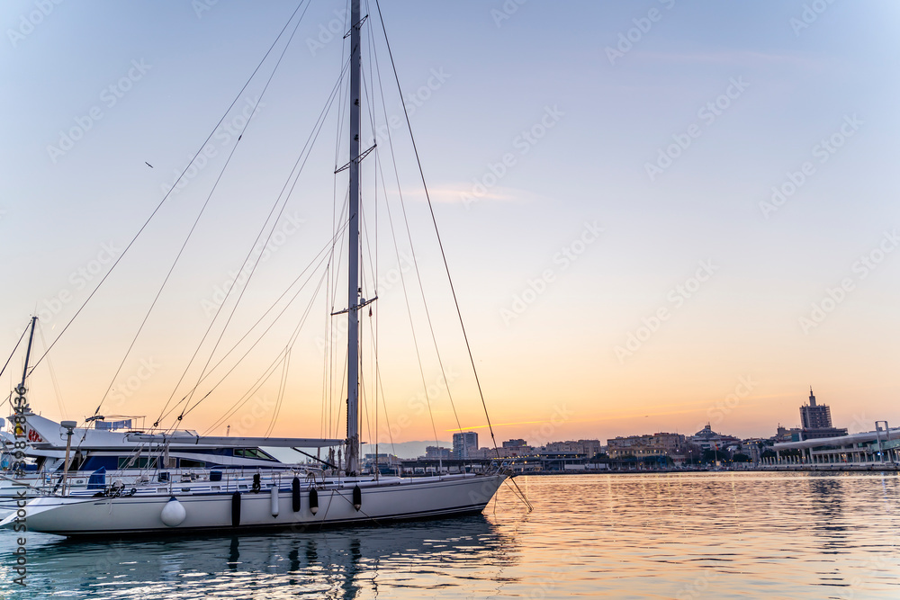 Sailing Boat with Clear Sky on Sunset with Copy Space in Port Water
