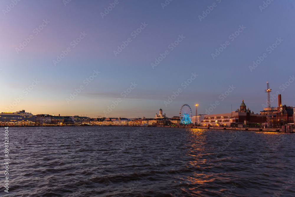 Scenic night view of the Old Town architecture and pier and Lutheran Christian Cathedral Church at the Senate Square in Helsinki, Finland, panoramic Presidential house.View Of Evening City Uspenski.