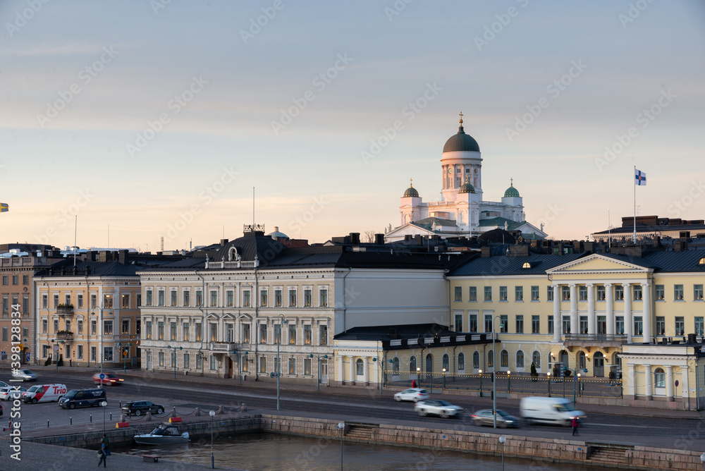 Scenic night view of the Old Town architecture and pier and Lutheran Christian Cathedral Church at the Senate Square in Helsinki, Finland, panoramic Presidential house.View Of Evening City Uspenski.