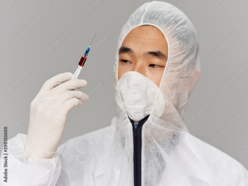 man in protective medical clothing close-up vaccine health man in protective medical clothing close-up vaccine health