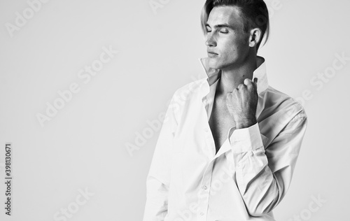 elegant man in shirt with tie light background portrait cropped view
