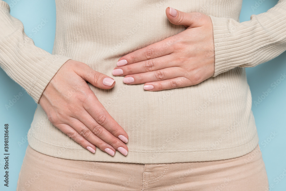 Close up of upset woman hold belly suffer from abdomen ache, female