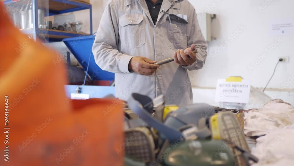 Worker to working in maintenance workshop in industrial factory
