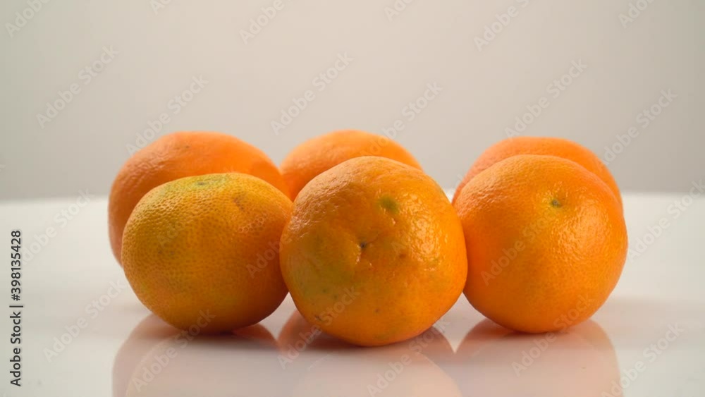 bright orange ripe tangerines rotate on their axis bright orange ripe tangerines rotate on their axis
