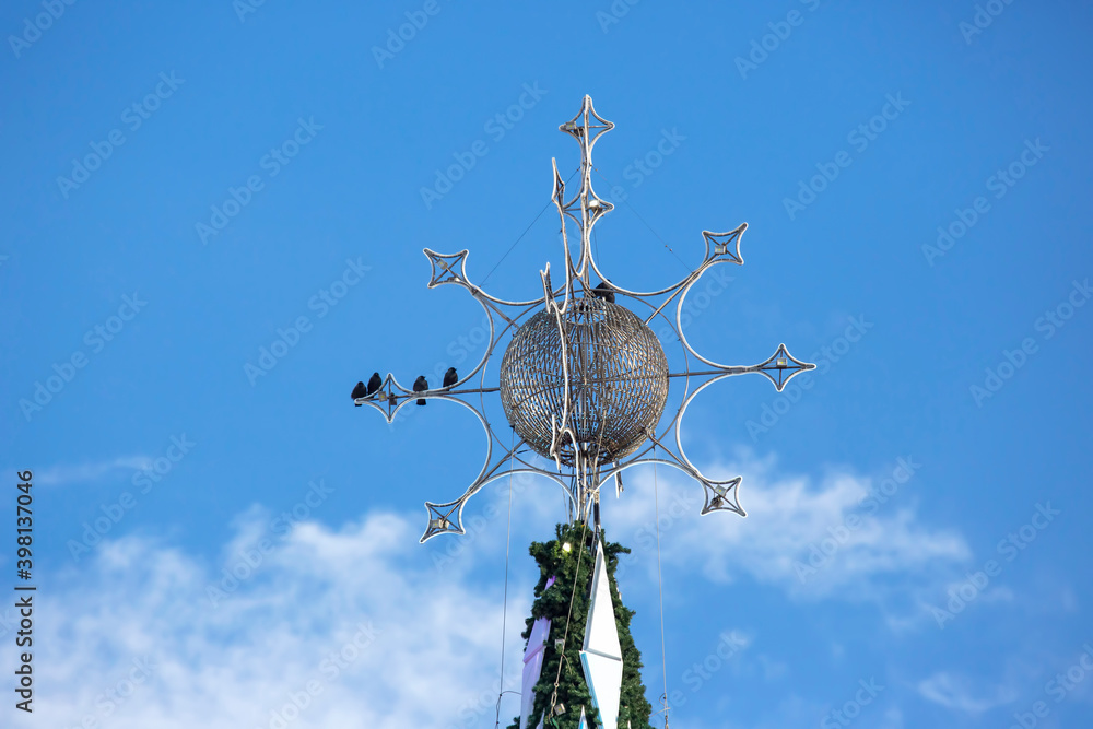 decorated Christmas tree on the background of blue sky