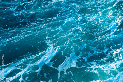 Background shot of clear sea water surface texture tidewater green color