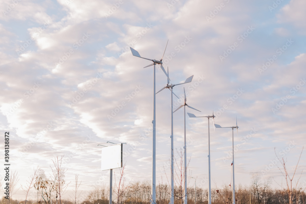 White windmills and blue sky with clouds. White windmills and blue sky with clouds.
