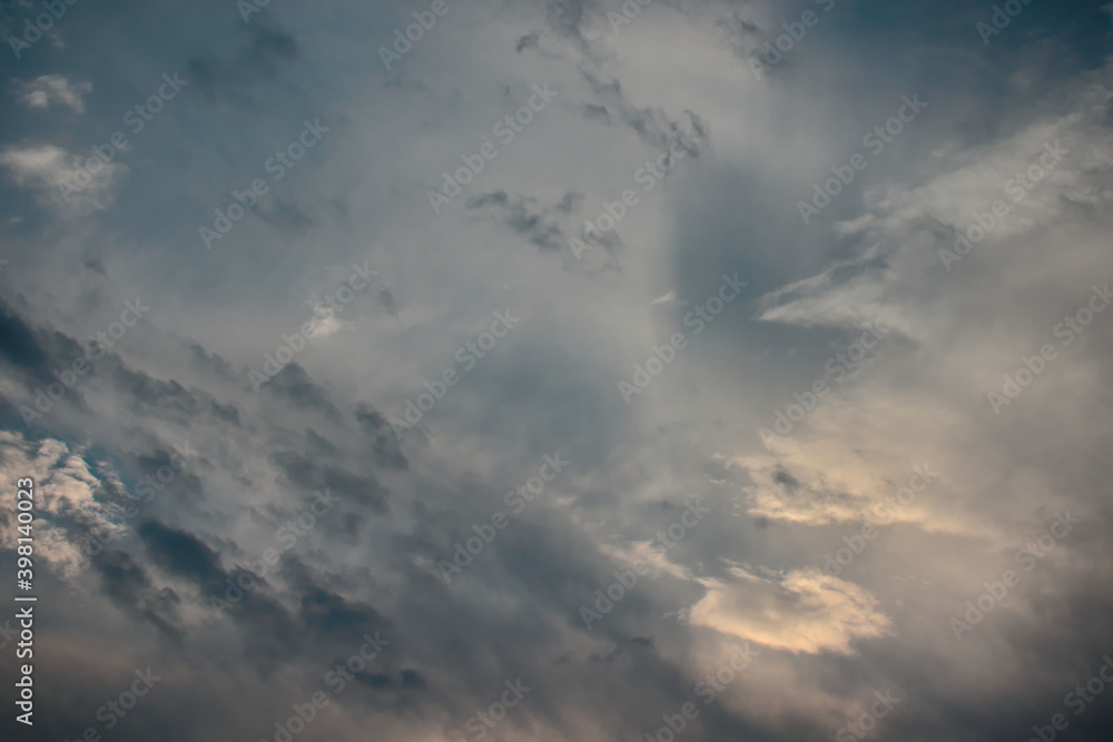 paradisiacal sky, covered by a thin veil of fog, with tufts of white and gray clouds blown by the winds, dividing the space. paradisiacal sky, covered by a thin veil of fog, with tufts of white and gray clouds blown by the winds, dividing the space.