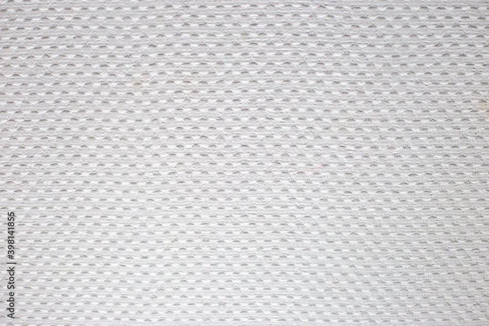 White texture on the wall. Dots in a checkerboard pattern as wallpaper White texture on the wall. Dots in a checkerboard pattern as wallpaper