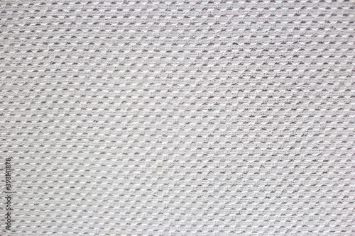 White texture on the wall. Dots in a checkerboard pattern as wallpaper