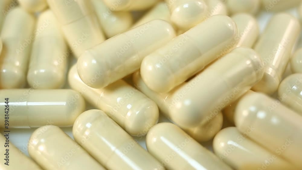 A bunch of transparent capsules with white powder inside primarially. Extreme close-up, real time, medicine, pharmacy A bunch of transparent capsules with white powder inside primarially. Extreme close-up, real time, medicine, pharmacy