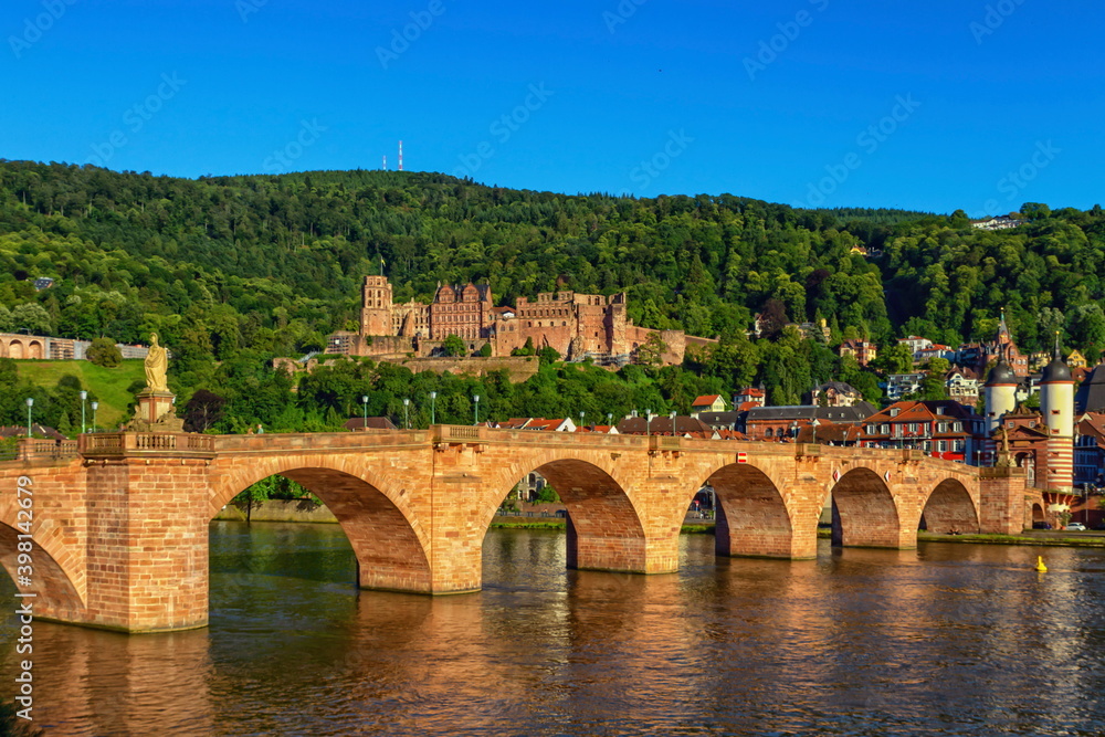 Karl Theodor bridge, river Neckar and castle in Heidelberg by day, Germany