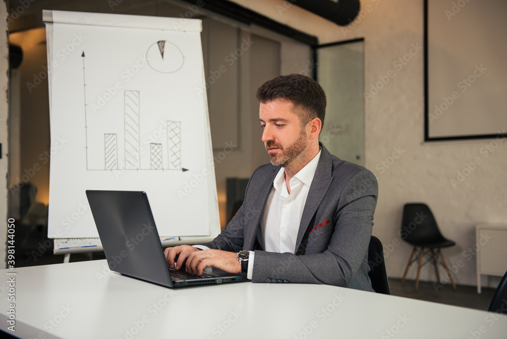 Portrait of businessman working on his laptop Portrait of businessman working on his laptop