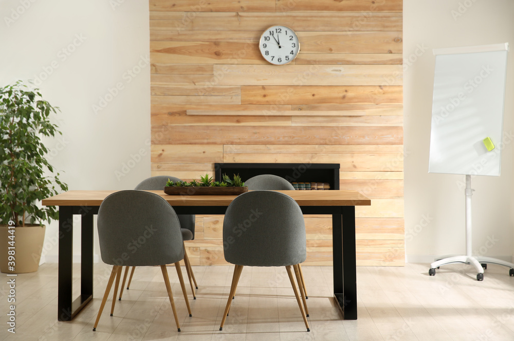 Modern meeting room interior with large table and chairs Modern meeting room interior with large table and chairs