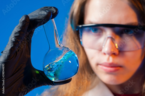 Woman scientist looks at a ...