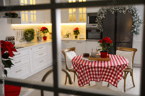 Beautiful kitchen interior with Christmas decor  view through window