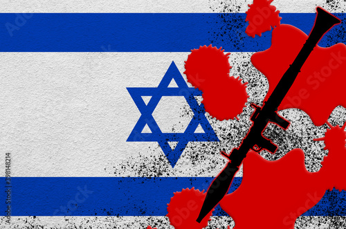 Israel flag and black RPG-7 rocket-propelled grenade launcher in red blood. Concept for terror attack or military operations with lethal outcome photo