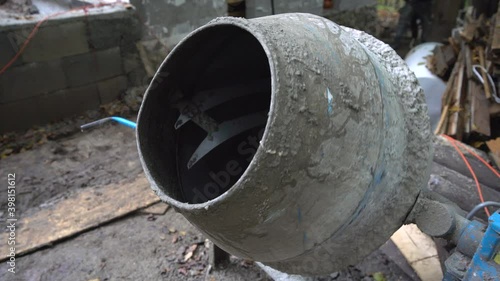 Small cement mixer mixing concrete