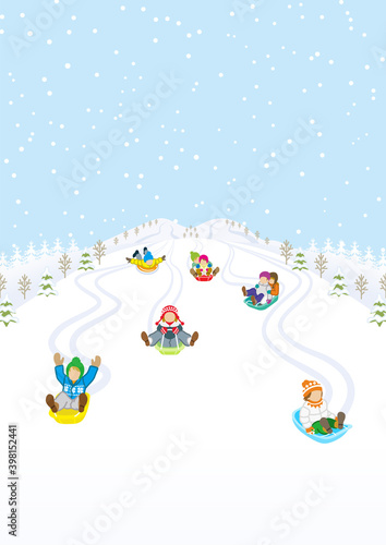 Children sledding in the winter snowcoverd mountain