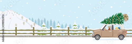 Car driving in winter snow coverd road, Brown car carrying fir tree