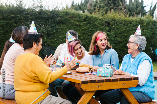 Latin Family happy birthday celebration garden party outside in the backyard in Mexico City