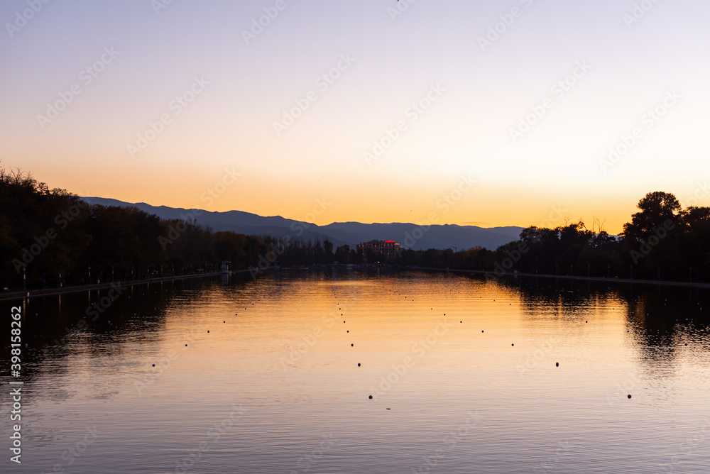 Obraz premium Autumn landscape beautiful romantic park with rowing canal colorful sunset dark natural background in Plovdiv, Bulgaria