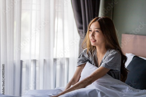 Beautiful long hair women sitting on the bed. Free Download Beautiful long hair women sitting on the bed. - GFXLoad