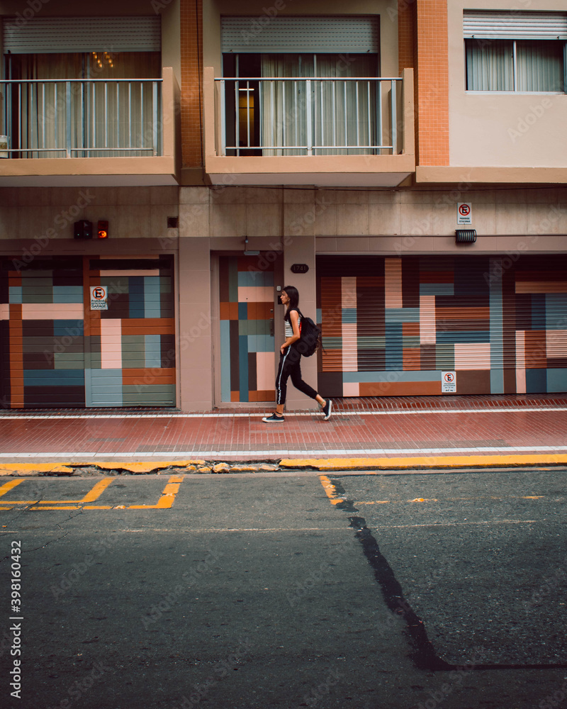 Young woman walking in the city