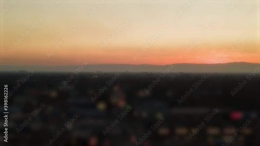 Orange Sunset behind mountains Hyperlapse tilt shift effect at Sunset Orange Sunset behind mountains Hyperlapse tilt shift effect at Sunset