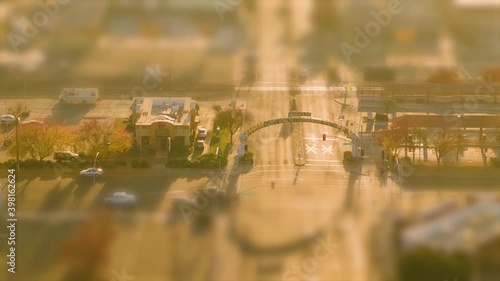 Small town intersection hyper lapse at sunset with miniature tilt shift effect