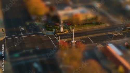 Small town intersection hyper lapse at sunset with miniature tilt shift effect