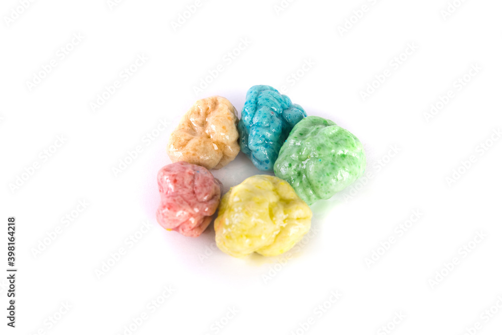 Circle of multiple colors of chewed bubble gum top down view