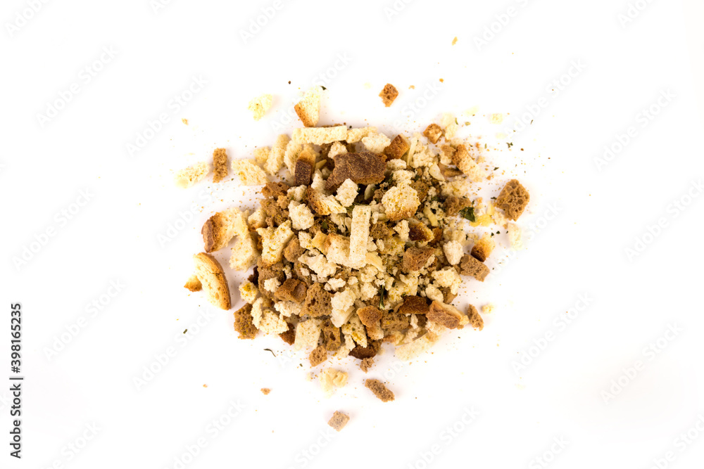 Cup of uncooked bread stuffing and spices top down view isolated over white Cup of uncooked bread stuffing and spices top down view isolated over white