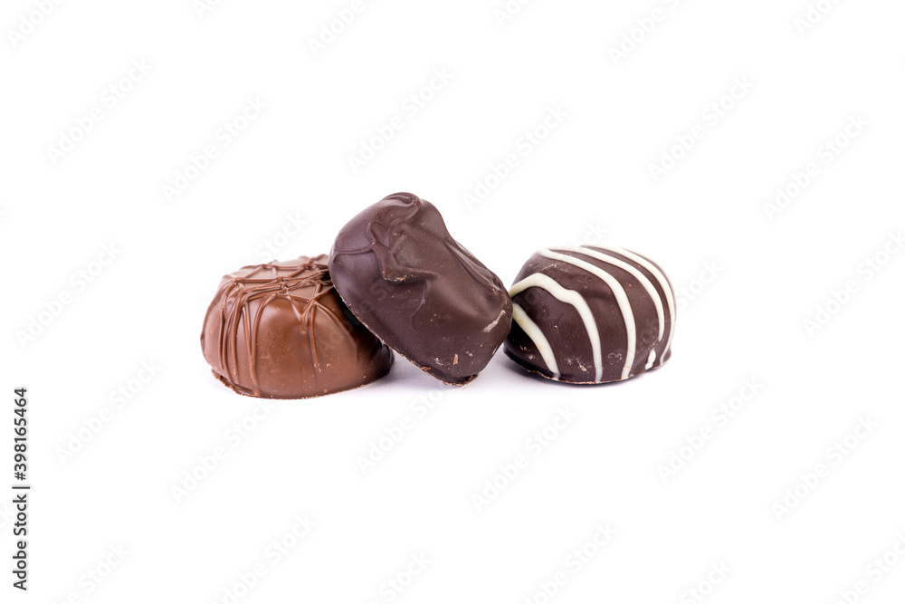 Fototapeta premium Milk dark and striped filled chocolate bonbon snuggling together