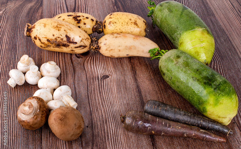 Champignon Mushroom and Lotus Root on wooden table background