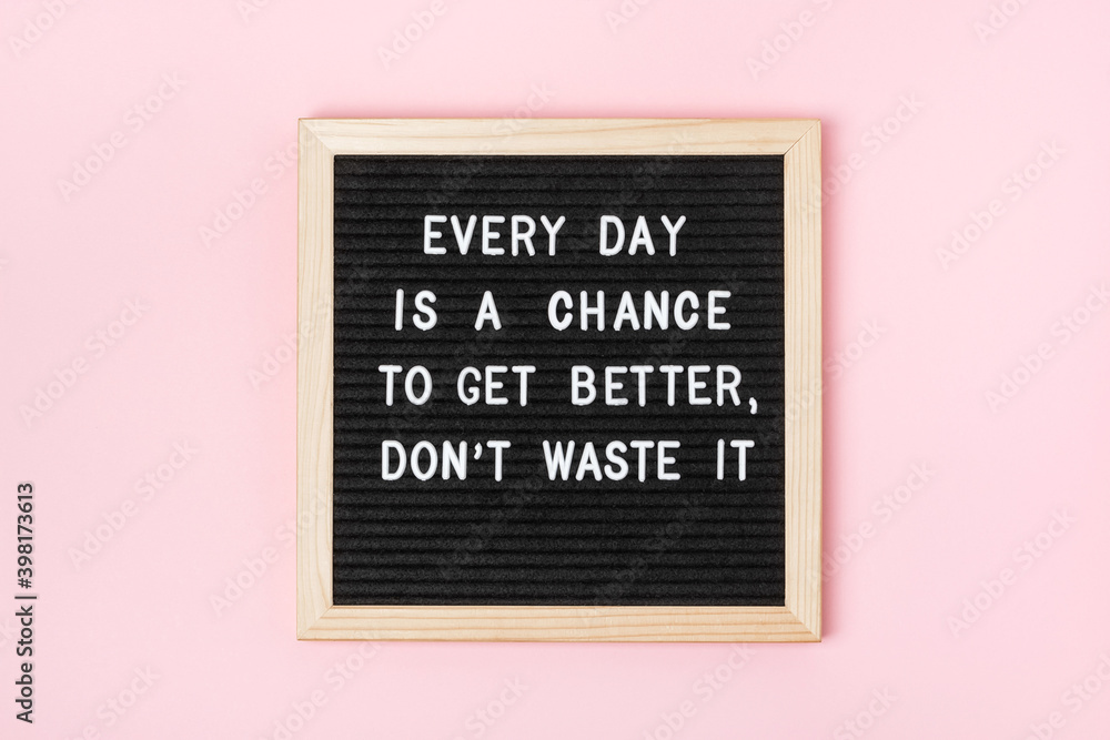 Fototapeta Every day is a chance to get better, don't waste it. Motivational quote on black letter board on pink background. Concept inspirational quote of the day. Greeting card, postcard