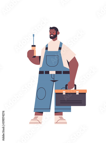 african american professional repairman in uniform holding screwdriver and toolbox home maintenance repair service concept full length vertical isolated vector illustration