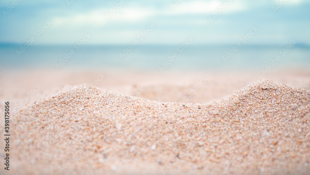 Sand desert pile with blur blue sea and blue sky on coast for contains articles about the sea or travel summer in holiday or environmental protection. Sand desert pile with blur blue sea and blue sky on coast for contains articles about the sea or travel summer in holiday or environmental protection.