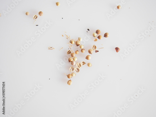 Coriander seeds on white background