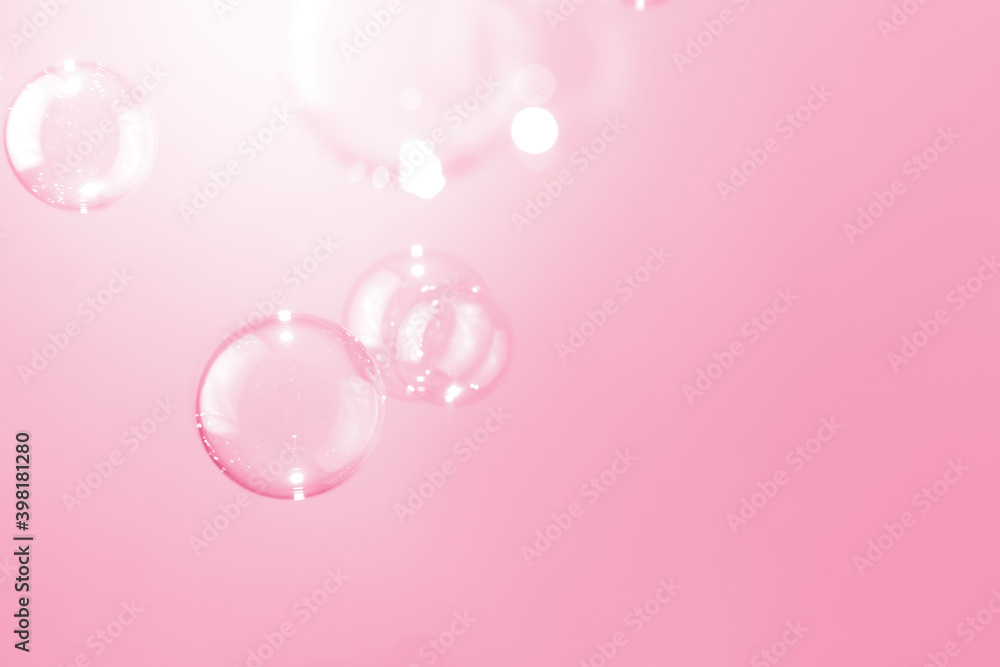 Transparrent soap bubbles float on pink background. Transparrent soap bubbles float on pink background.