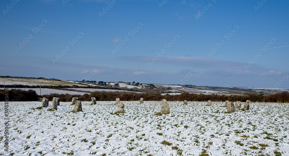 A light dusting of snow over the Merry Maidens, a neolithic stone circle in west Cornwall, England, UK.
