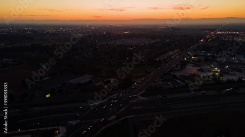 Hyperlapse Miniature Effect Tilt Shift of Sunset over Small Town with cars and traffic