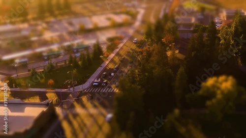 Hyperlapse Miniature Effect Tilt Shift of Sunset over Small Town with cars and traffic