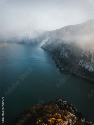 Foggy autumn nature landscape in Dubova Bay. Danube River, Romania